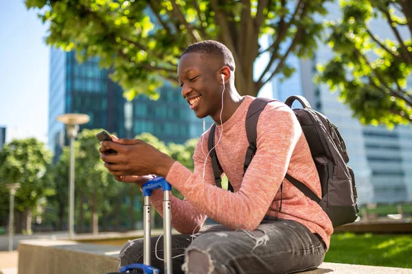 Portrait Happy Young Black Man Sitting Bags Looking Mobile Phone — Stock Photo, Image