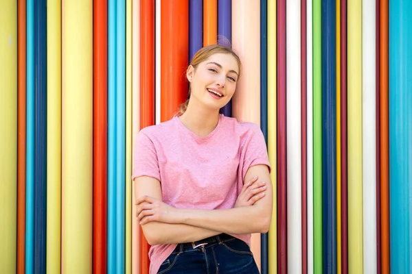 Portrait Blond Hair Teenager Girl Smiling Arms Crossed Colorful Background — Stock Photo, Image