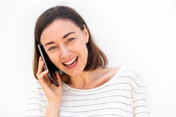Portrait Happy Middle Aged Woman Talking Mobile Phone White Wall — Stockfoto
