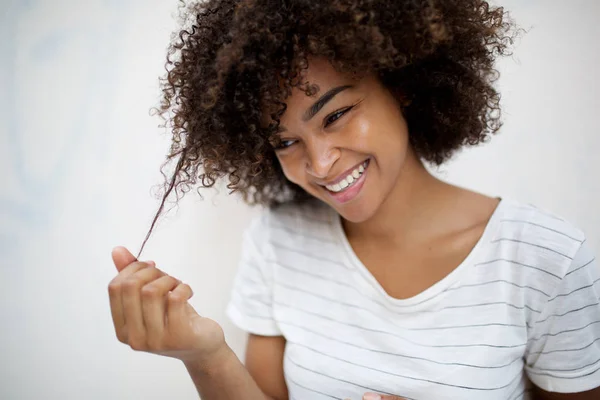 Portrait Smiling Young African American Woman Pulling Curly Hair — Stock Photo, Image