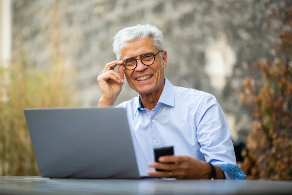 Portrait Smiling Businessman Sitting Laptop Mobile Phone — Stock Photo, Image