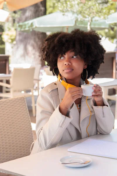 Young African American Woman Curly Hair Jacket Headphones Alone Drinking — Stock Photo, Image