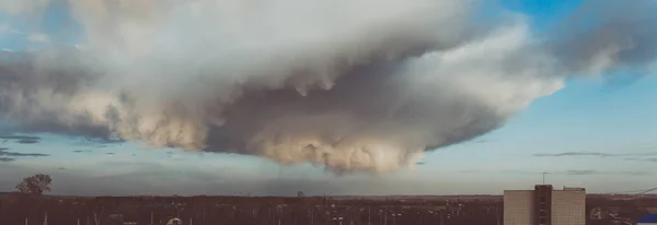 Storm clouds above the ground. Art processing. Storm clouds and sky.