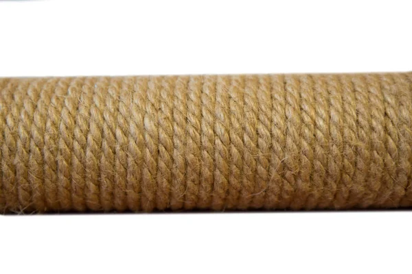 Rope tightly wound on a pipe for sharpening the claws of cats on a white background. — Stock Photo, Image