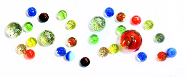 Top-view-of-various-multicolor-glass-marbles-on-white-backgrou —  Fotos de Stock