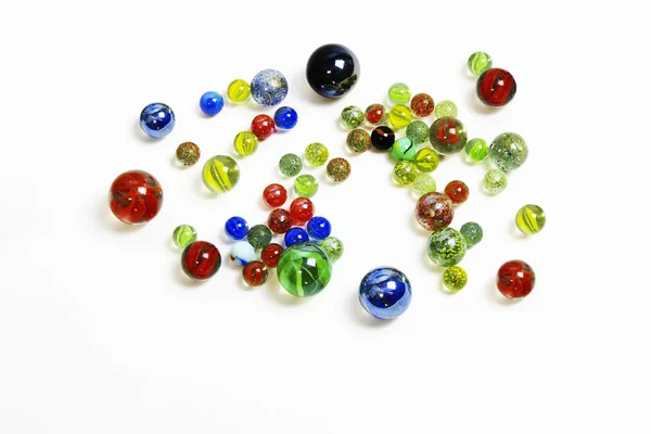 Background-of-various-multicolored-glass-balls-on-white — Stock Photo, Image