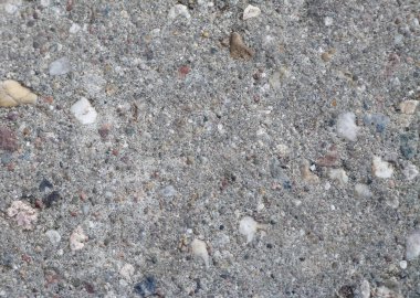 Karışık taşlı bir yüzey, arkaplan ve metnin üst görünümü