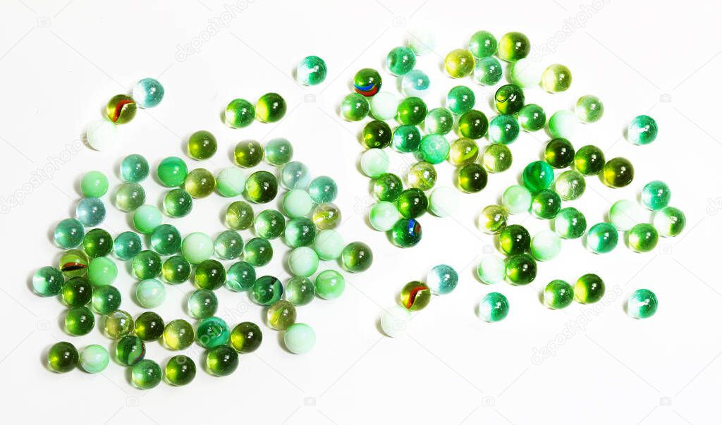 Background with various glass balls in green tone