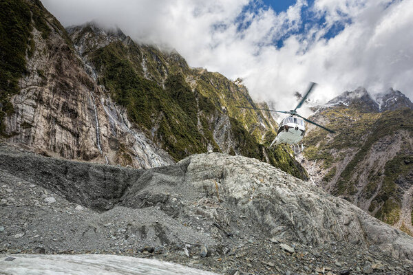 Franz Josef Glacier New Zealand, hikers approaching the glacier via helicopter