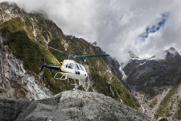 Franz Josef Glacier New Zealand, hikers approaching the glacier via helicopter