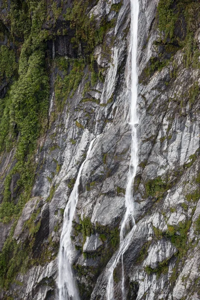 Waterfall and vegetation at Franz Josef Glacier, south island New Zealand