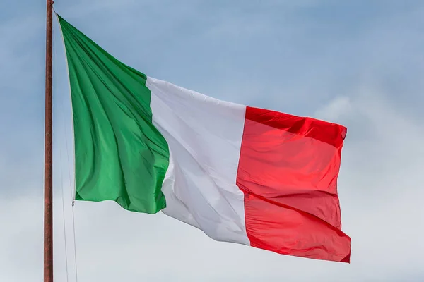 Italian flag flying in the breeze in Rome, Italy