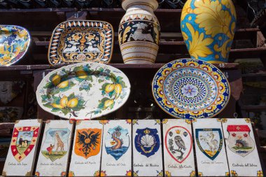 Siena Italy July 1st 2015 : Ceramic vases and tiles featuring some of the districts represented in the famous palio horse race clipart
