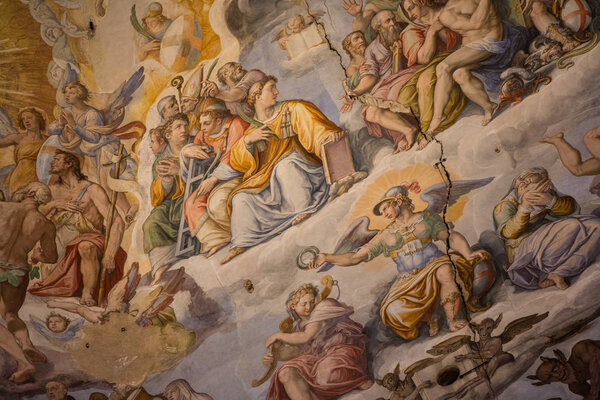 Florence, Italy July 3rd, 2015:  Looking up at teh stunning artwork inside the dome of the duomo in Florence, Italy