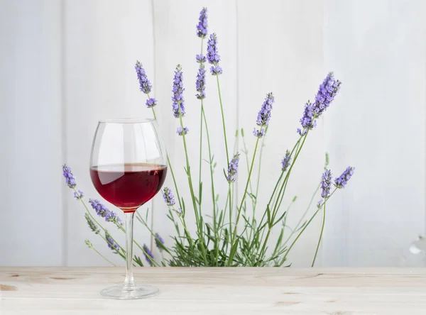 Glass of wine with lavender bush — Stock Photo, Image