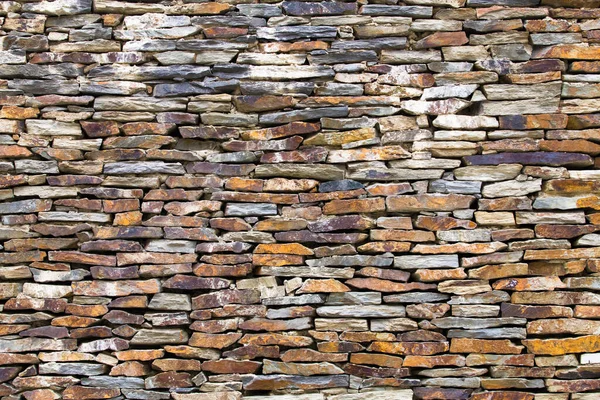 La pared está hecha de piedra triturada . — Foto de Stock