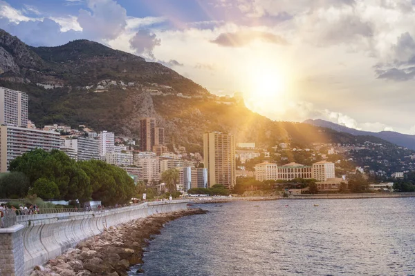 City on the Mediterranean coast at sunset. — Stock Photo, Image