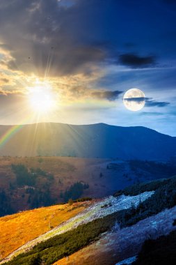 Tepedeki bir çayırda köknar ağaçları. Gündüz ve gece zaman kavramını değiştirir. Alacakaranlıkta güneş ve ay ile dağlarda kozalaklı orman. Sonbaharın başlarında dik yamaçlarda