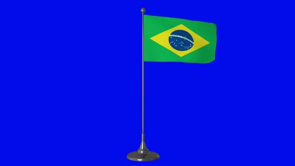 Маленький флаг Бразилии развевается на флагштоке. Синий фон экрана. 3d-рендеринг — стоковое фото