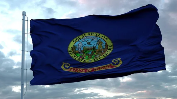 Σημαία του Idaho κυματίζει στον άνεμο ενάντια σε βαθιά όμορφα σύννεφα ουρανό. 3d απόδοση — Φωτογραφία Αρχείου