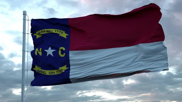 Флаг Северной Каролины, машущий на ветру против глубоких красивых облаков неба. 3d-рендеринг — стоковое фото