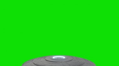 UFO geçişi yeşil ekranda. Uzaylı uçan daire yeşil ekran arka planında izole edildi