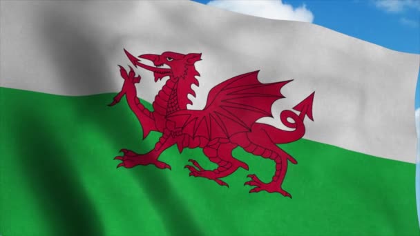 Wales vlag zwaaiend in de wind, blauwe lucht achtergrond. 4K — Stockvideo