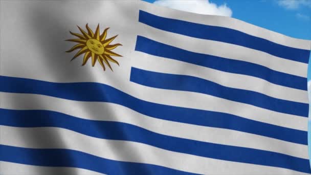 Bandera de Uruguay ondeando en el viento, fondo cielo azul. 4K — Vídeo de stock