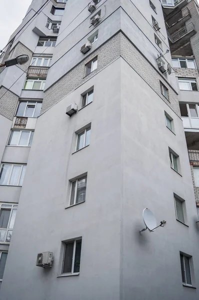 insulation of the facade, multi-storey residential building against the sky