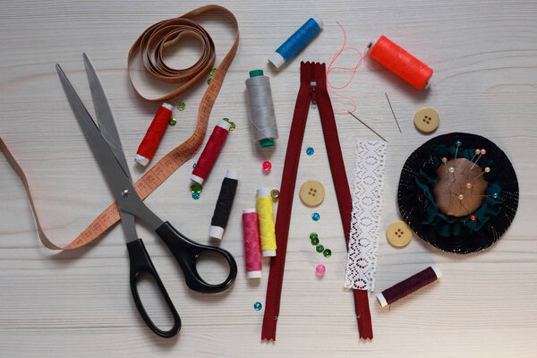 sewing set of threads, needles and scissors