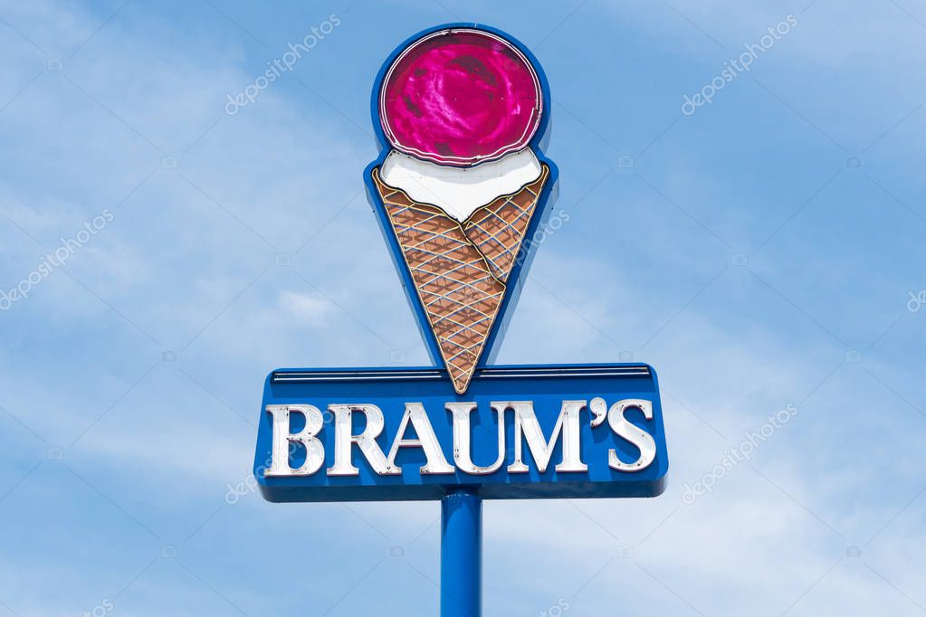 FAYETTEVILLE, AR/USA - JUNE 8, 2018: Braum's exterior sign and trademark logo. Braum's is an American family-owned restaurant chain based in Tuttle, Oklahoma.