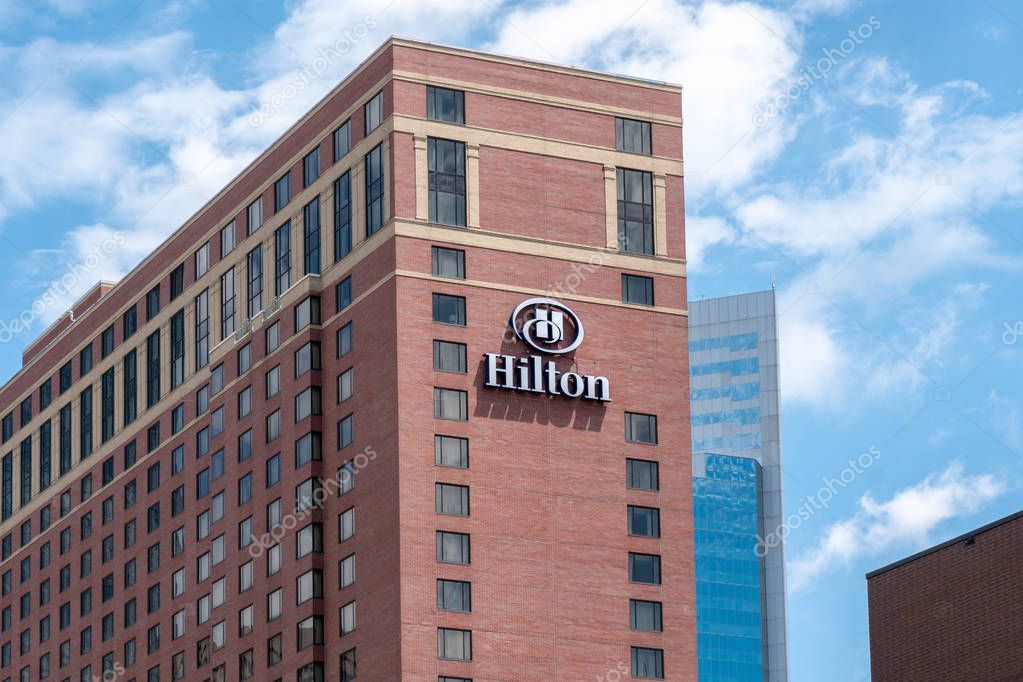 MINNEAPOLIS, MN/USA - JUNE 30, 2018: Hilton Hotel exterior and trademark logo. Hilton Hotels and Resorts is a global brand of full-service hotels.
