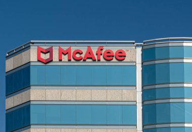 SANTA CLARA, CA/USA - OCTOBER 20, 2018: McAfee corporate headquarters building and trademark logo. McAfee is part of the Intel Security division. clipart