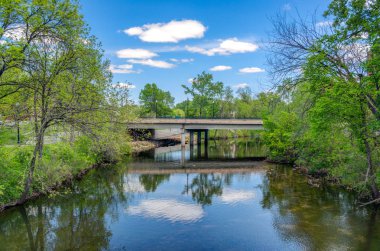 Kinnickinnic River and bridge in River Falls, Wisconsin clipart