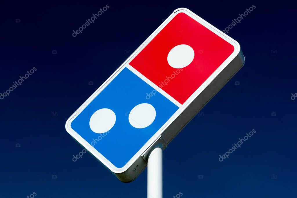NEW RICHMOND, WI/USA - MAY  31, 2020: Domino's Pizza exterior sign and trademark logo.