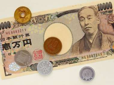 Japanese yen lie on a beige background. Close-up clipart
