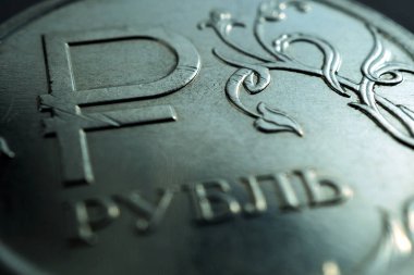 Yazının çevirisi: Ruble. Rusya 'nın ulusal para biriminin sembolü olan Rus 1-1 ruble sikkesi. Para, ekonomi ve finans teması üzerine koyu mavi ve yeşil tonlu çizimler