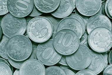 10 ruble 'lik Rus paralarının yüzeyi. Tek renkli mavi renkli yeşil renkli arka plan ya da duvar kağıdı. Rusya 'da ekonomik, finansal ya da bankacılık temalı bir fon. Yukarıdan bak. Makro