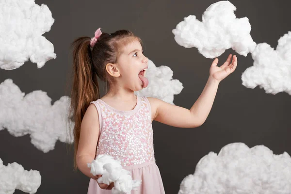 Girl Touches Clouds Plays Shot Studio Gray Background — Stock Photo, Image