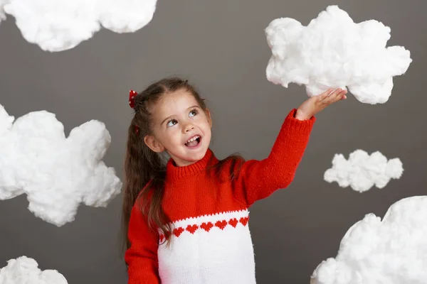 Girl Playing Clouds Dressed Red Sweater Shot Studio Gray Background — Stock Photo, Image