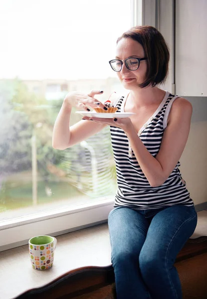 Girl Eating Tasty Cakes Sitting Window Sweet Food Pleasure — Stock Photo, Image