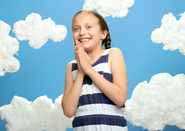 Girl Dressed Striped Dress Posing Blue Background Cotton Clouds Concept — Stock Photo, Image