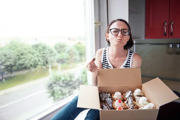 Girl Eating Tasty Cakes Sitting Window Sweet Food Pleasure — Stock Photo, Image