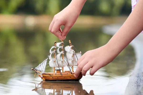 Girl Playing Toy Sailing Ship River Hand Closeup — Stock Photo, Image