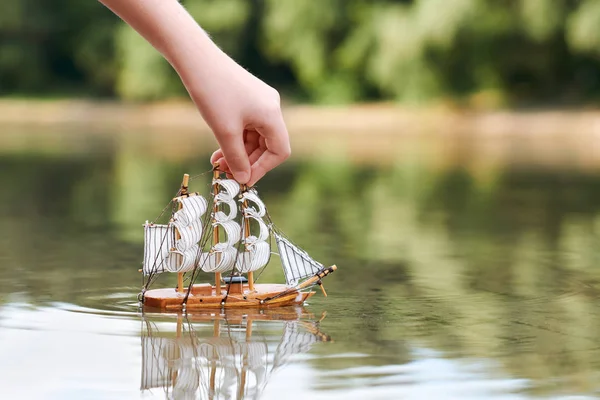 Girl Playing Toy Sailing Ship River Hand Closeup — Stock Photo, Image