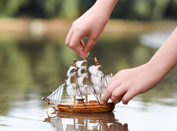 Girl Playing Toy Sailing Ship River Hand Closeup — Stock Photo, Image