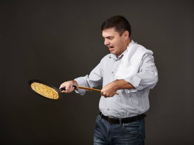 man posing with a pancake in a pan, white shirt and pants, gray background, surprised emotions clipart