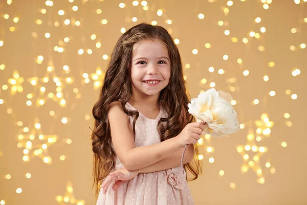 Girl Child Christmas Lights Yellow Background Pink Dress — Stock Photo, Image