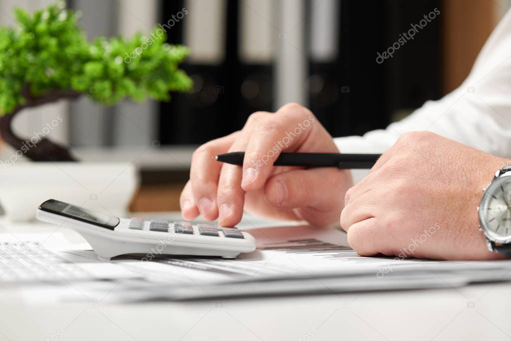 Businessman working in office and calculating finance. Business financial accounting concept.