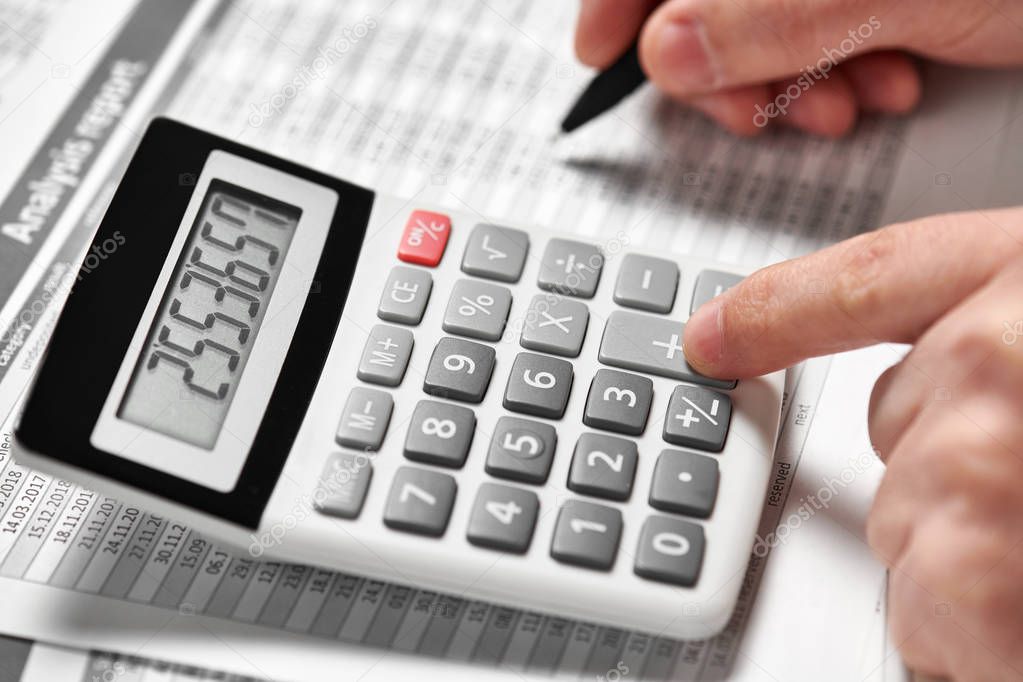 Businessman working and calculating finance. Business financial accounting concept. Closeup hands.
